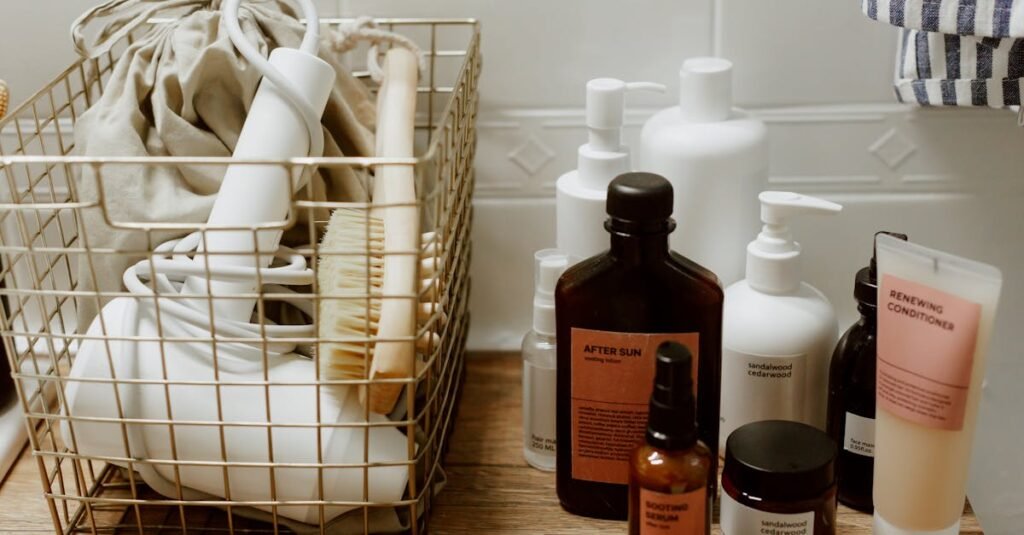 Neatly arranged bathroom toiletries and storage items on a wooden surface, featuring cosmetics and a hair dryer.